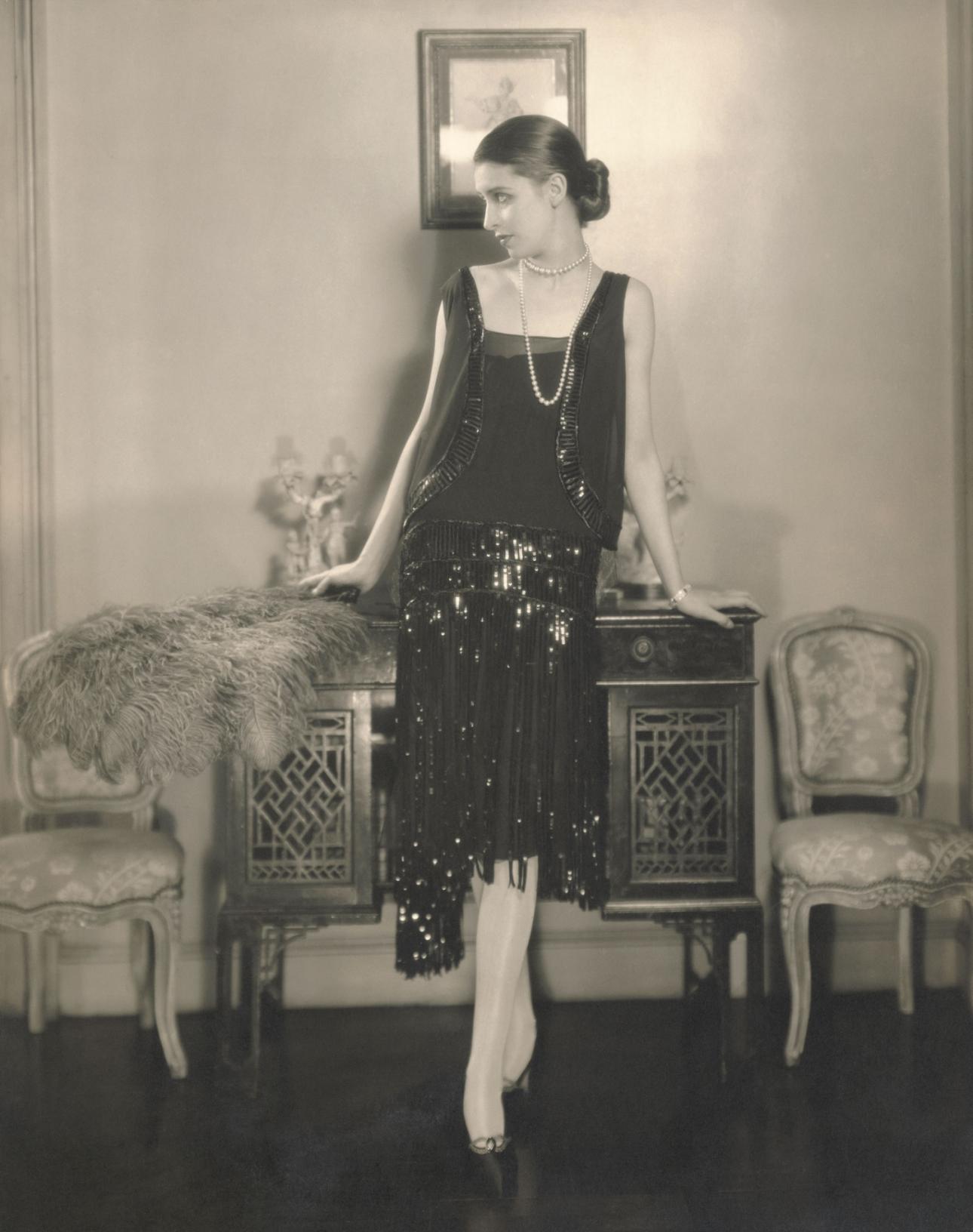 Model, Marion Morehouse, wearing a black crepe romain bolero dress with fringed and paillette embroidered skirt by Chanel. Photo by Edward Steichen, published in Vogue US, 1926 Edward Steichen/Condé Nast/Shutterstock