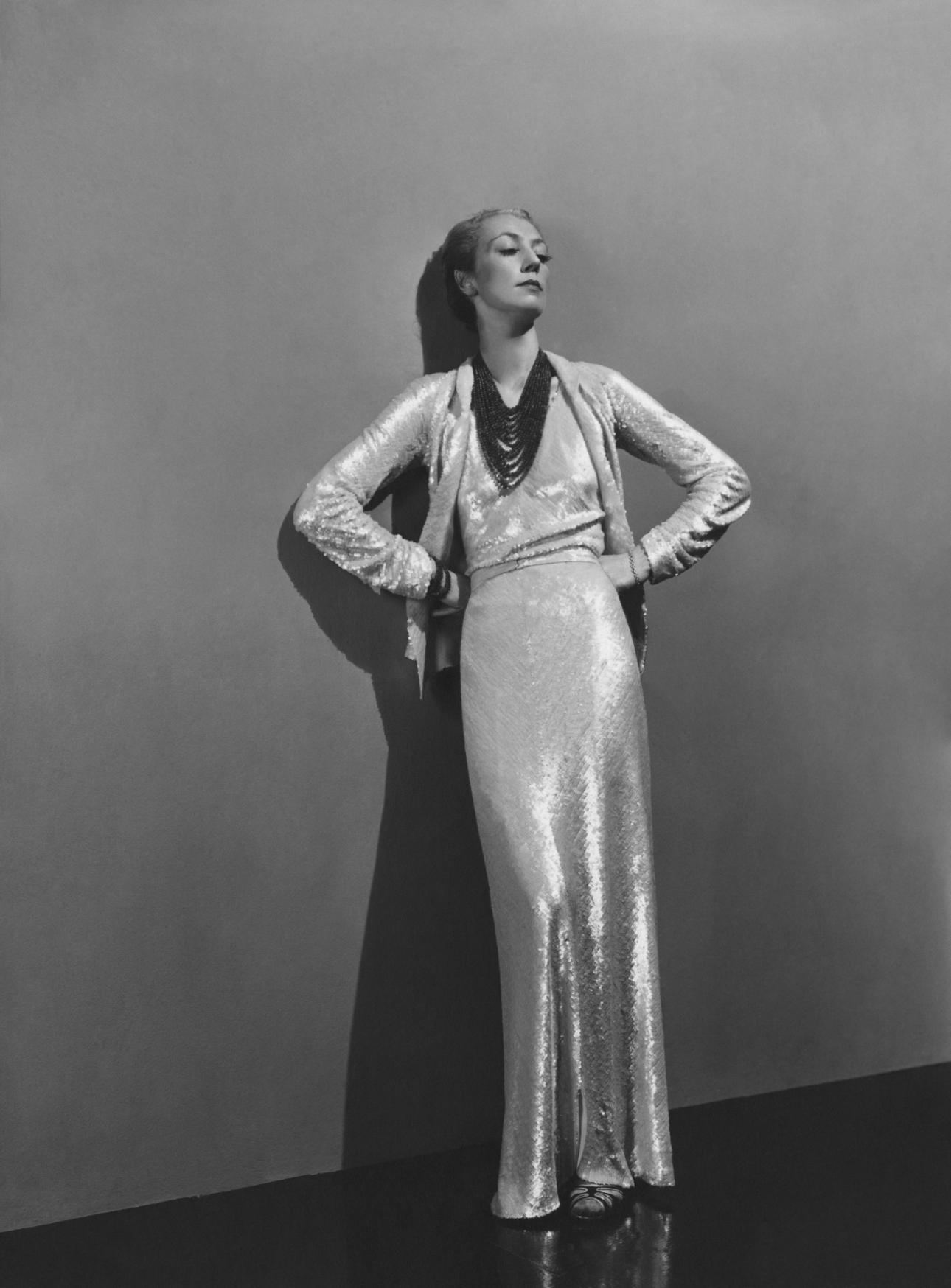 Roussy Sert wearing a long white sequin dress by Chanel, and a 15-strand coral necklace, Photograph by André Durst, published in Vogue December 15, 1936 Photograph: Andre Durst/Condé Nast/Shutterstock